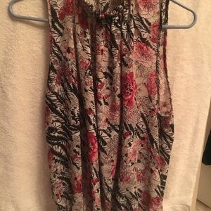 High neck sleeveless blouse.